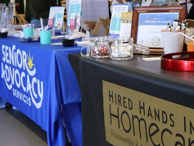 Photo of a exhibitor table at the 2024 conference.