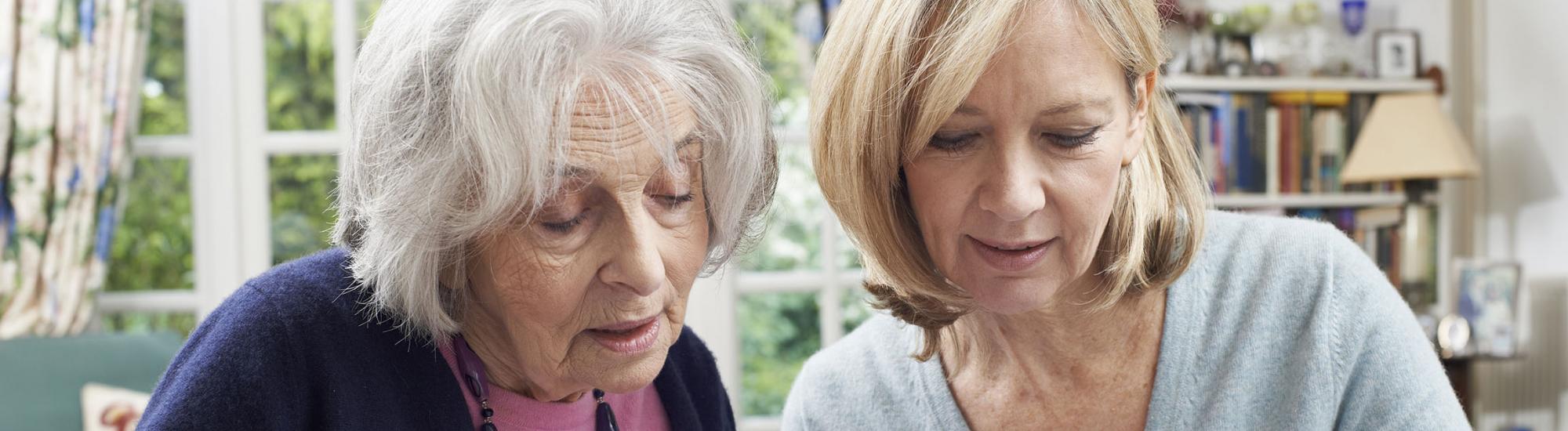 two women at table talking