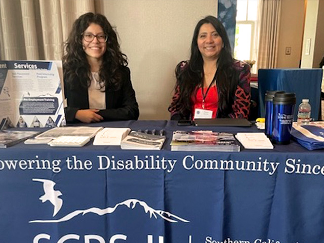 Photo of a exhibitor table at the 2024 conference.